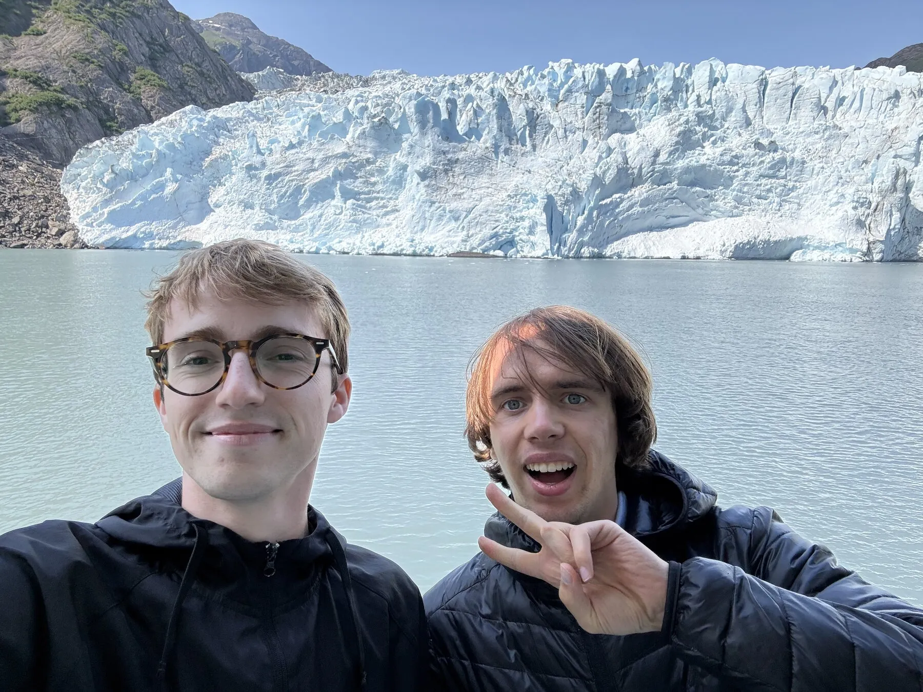 Us on the boat with the glacier behind them
