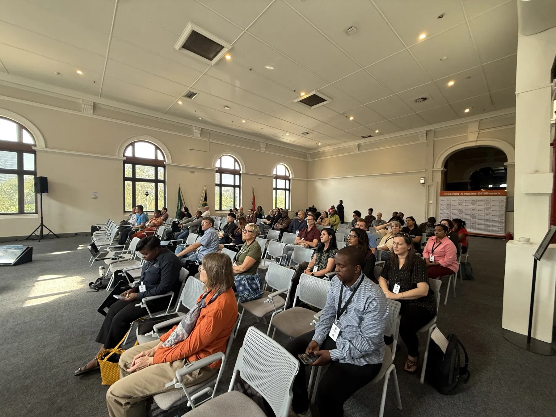 Conference attendees seated in a session at the Iziko South African Museum